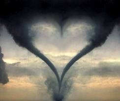 Dark clouds forming a heart shape in the sky